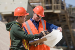 Two engineers planning at a gravel and asphalt plant